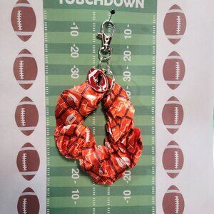 Football Themed Wristlet Keyring with a Football related charm attached !!